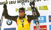 Winner Martin Fourcade of France celebrates his medal won in the men pursuit race of IBU Biathlon World Cup in Pokljuka, Slovenia.  Men pursuit race of IBU Biathlon World cup was held in Pokljuka, Slovenia, on Saturday, 10th of December 2016.
