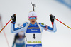 Second placed Kaisa Makarainen of Finland celebrates while crossing the finish line during the women pursuit race of IBU Biathlon World Cup in Pokljuka, Slovenia. Women pursuit race of IBU Biathlon World cup was held in Pokljuka, Slovenia, on Friday, 9th of December 2016.
