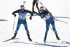 Martin Fourcade of France (L) and Simon Desthieux of France (R) during the men relay race of IBU Biathlon World Cup in Pokljuka, Slovenia. Men relay race of IBU Biathlon World cup was held in Pokljuka, Slovenia, on Sunday, 11th of December 2016.
