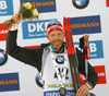 Third placed Simon Eder of Austria celebrates on the podium after the men individual race of IBU Biathlon World Cup in Pokljuka, Slovenia. Men 20km individual race of IBU Biathlon World cup 2018-2019 was held in Pokljuka, Slovenia, on Thursday, 6th of December 2018.
