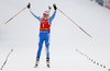 Winner Kaisa Makarainen of Finland celebrates her victory when crossing finish line of the women pursuit race of IBU Biathlon World Cup in Pokljuka, Slovenia. Women pursuit race of IBU Biathlon World cup 2018-2019 was held in Pokljuka, Slovenia, on Sunday, 9th of December 2018.
