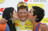 Winner Jakob Fuglsang of Denmark (Team Saxo Bank) in yellow jersey as the best cyclist in general classification at the flower ceremony of the first stage of Tour de Slovenie 2009 from Koper, Slovenia to Villach (Austria). The first stage was 229 km long and it was held on Thursday, 18th of June, 2009.
