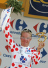 Jussi Veikkanen of Finland (Francaise des Jeux) in polka dot jersey as the best rider in mountain classification at the flower ceremony of the second stage of Tour de France from Monaco to Brignoles (187 km).  The second stage was held on Sunday, 5th of July.  <br> 
