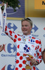 Jussi Veikkanen of Finland (Francaise des Jeux) in polka dot jersey as the best rider in mountain classification at the flower ceremony of the team time trial of the fourth stage of Tour de France from Montpellier to Montpellier (39 km).  The fourth stage was held on Tuesday, 7th of July.  <br> 
