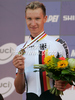Third placed Patrick Gretsch of Germany celebrates his medal won in men U23 UCI Road cycling World Championships time trial race in Mendrisio, Switzerland. 33.2km long men U23 time trial race was held in Mendrisio, Switzerland, on 23rd of September 2009.
