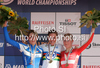 Winner Kristin Armstrong of USA (M), second placed Noemi Cantele of Italy (L) and third placed Linda Melanie Villumsen of Denmark (R) celebrate their medals won in women UCI Road cycling World Championships time trial race in Mendrisio, Switzerland. 26.8km long women time trial race was held in Mendrisio, Switzerland, on 23rd of September 2009.
