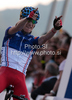 Winner Romain Sicard of France celebrating his victory when crossing finish line of Men U23 UCI Road cycling World Championships road race in Mendrisio, Switzerland. 179.4km long Men U23 road race was held in Mendrisio, Switzerland, on 26th of September 2009.
