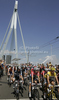 In front Andy Schleck of Luxembourg (Team Saxo Bank) and Fabian Cancellara of Switzerland (Team Saxo Bank) in yellow jersey at the official start at the Erasmusbrug bridge of the first stage of the 97th Tour de France from Rotterdam (Netherlands) to Bruxelles (Belgium). The stage was 223,5 km long. The first stage of 97th of Tour de France 2010 from Rotterdam to Bruxelles was held on Sunday, 4th of July 2010 in Netherlands and Belgium.
