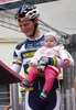 Grega Bole of Slovenia (Vacansoleil DCM Pro Cycling Team) whit his daughter Lia at the start of the stage 11 of the Giro di Italia 2013 from Tarvisio to Vajont (Erto e Casso). The stage 11 from Tarvisio to Vajont (Erto e Casso) was 182 km long and it was held on Wednesday, 15th of May 2013 in Italy.
