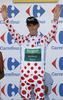Pierre Rolland of France (Team Europcar) in polka dot jersey as the best rider in mountain classification at the flower ceremony of the third stage of 100th Tour de France 2013. The third stage from Ajaccio to Calvi was 145,5 km long and it was held on Monday, 1st of July, 2013 in Corsica, France.
