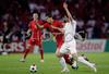 Portugals forward Cristiano Ronaldo, left, fights for the ball with Turkeys midfielder Hakan Balta during the Euro 2008 Group A soccer match between Portugal and Turkey at the Stade de Geneve stadium in Geneva, Switzerland, Saturday June 7, 2008.

