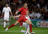 Portugals defender Pepe, left, fights for the ball with Turkeys defender Emre Asik during the Euro 2008 Group A soccer match between Portugal and Turkey at the Stade de Geneve stadium in Geneva, Switzerland, Saturday June 7, 2008.
