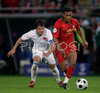 Portugals forward Nani, right, fights for the ball with Turkeys midfielder Emre Belozoglu during the Euro 2008 Group A soccer match between Portugal and Turkey at the Stade de Geneve stadium in Geneva, Switzerland, Saturday June 7, 2008.

