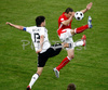 Germanys midfielder Michael Ballack, left, fights for the ball with Polands defender Dariusz Dudka during the Euro 2008 Group B soccer match between Germany and Poland at the Woerthersee stadium in Klagenfurt, Austria, Sunday June 8, 2008.
