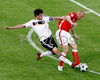 Germanys midfielder Michael Ballack, left, fights for the ball with Polands midfielder Mariusz Lewandowski during the Euro 2008 Group B soccer match between Germany and Poland at the Woerthersee stadium in Klagenfurt, Austria, Sunday June 8, 2008.
