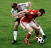 Germanys defender Clemens Fritz, left, fights for the ball with Polands midfielder Jacek Krzynowek during the Euro 2008 Group B soccer match between Germany and Poland at the Woerthersee stadium in Klagenfurt, Austria, Sunday June 8, 2008.
