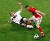 Germanys defender Clemens Fritz, left, fights for the ball with Polands midfielder Jacek Krzynowek during the Euro 2008 Group B soccer match between Germany and Poland at the Woerthersee stadium in Klagenfurt, Austria, Sunday June 8, 2008.
