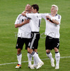 Germanys forward Lukas Podolski, left, celebrates with his teammates Miroslav Klose and Bastian Schweinsteiger after scoring his second gol against Poland during the Euro 2008 Group B soccer match between Germany and Poland at the Woerthersee stadium in Klagenfurt, Austria, Sunday June 8, 2008.
