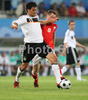 Germanys midfielder Michael Ballack, left, fights for the ball with Polands midfielder Jacek Krzynowek during the Euro 2008 Group B soccer match between Germany and Poland at the Woerthersee stadium in Klagenfurt, Austria, Sunday June 8, 2008.
