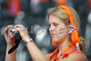 A Netherlands fan takes a picture prior to the kick off of the Euro 2008 Group C soccer match between Netherlands and Italy at the Stade de Suisse stadium in Berne, Switzerland, Monday June 9, 2008.
