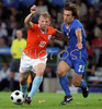 Netherlands forward Dirk Kuyt, left, fights for the ball with Italys midfielder Andrea Pirlo during the Euro 2008 Group C soccer match between Netherlands and Italy at the Stade de Suisse stadium in Berne, Switzerland, Monday June 9, 2008.

