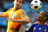 Romanias defender Cosmin Moti, left, fights for the ball with Frances midfielder Florent Malouda during the Euro 2008 Group C soccer match between Romania and France at the Letzigrund stadium in Zurich, Switzerland, Monday June 9, 2008.
