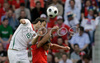 Portugals defender Ricardo Carvalho, left, and Czech Republics forward Milan Baros fight for the ball during the Euro 2008 Group A soccer match between Czech Republic and Portugal at the Stade de Geneve stadium in Geneva, Switzerland, Wednesday June 11, 2008.
