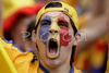 A Romanian fan cheers before the Euro 2008 Group C soccer match between Italy and Romania at the Letzigrund stadium in Zurich, Switzerland, Friday June 13, 2008.
