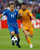Italys midfielder Andrea Pirlo, left, fights for the ball with Romanias defender Razvan Rat during the Euro 2008 Group C soccer match between Italy and Romania at the Letzigrund stadium in Zurich, Switzerland, Friday June 13, 2008.
