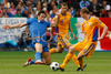 Italys forward Luca Toni, left, fights for the ball with Romanias defender Dorin Goian, right, while Romanias defender Gabriel Tamas, center, looks on during the Euro 2008 Group C soccer match between Italy and Romania at the Letzigrund stadium in Zurich, Switzerland, Friday June 13, 2008.
