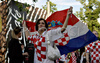 A Crotian fan waves the croatian flag in Zurich after the Euro 2008 Group B soccer match between Croatia and Germany, Switzerland, Thursday June 12, 2008.
