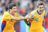 Romanias forward Daniel Niculae, left, celebrates with Romanias forward Adrian Mutu after scoring against Italy during the Euro 2008 Group C soccer match between Italy and Romania at the Letzigrund stadium in Zurich, Switzerland, Friday June 13, 2008.
