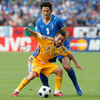 Romanias midfielder Florentin Petre, front, fights for the ball with Italys defender Fabio Grosso during the Euro 2008 Group C soccer match between Italy and Romania at the Letzigrund stadium in Zurich, Switzerland, Friday June 13, 2008.

