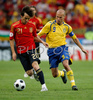 Spains forward David Silva, left, and Swedens midfielder Fredrik Ljungberg fight for the ball during the Euro 2008 Group D soccer match between Sweden and Spain at the Tivoli Neu stadium in Innsbruck, Austria, Saturday June 14, 2008.
