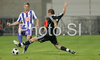 Lukasz Piszczek (no.26) of BSC Hertha (L) and Ermin Rakovic (no.8) of NK Interblock (R) during football match of second qualifying round of UEFA Cup between NK Interblock Ljubljana, Slovenia and Hertha BSC Berlin, Germany. First match of second qualifying round for UEFA Cup was played in Petrol Arena in Celje, Slovenia, on 14th of August 2008.
