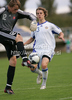 Roope Riski of Finland (R) and goalie Pavol Bajza of Slovakia (L) during football match of U19 UEFA European Championships Qualification tournament between Slovakia and Finland. Match between Slovakia and Finland was played in Murska Sobota, Slovenia, on 11th of October 2009.
