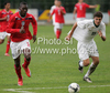Frank Nouble of England (L) and Nik Cimpric of Slovenia (R) during football match of U19 UEFA European Championships Qualification tournament between Slovenia and England. Match between Slovenia and England was played in Murska Sobota, Slovenia, on 11th of October 2009.
