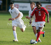 Nathan Delfouneso of England (R) and Haris Vuckic of Slovenia (L) during football match of U19 UEFA European Championships Qualification tournament between Slovenia and England. Match between Slovenia and England was played in Murska Sobota, Slovenia, on 11th of October 2009.
