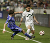 Jonas Tor Naes of Faroe Islands (L) and Andraz Kirm of Slovenia during football match of UEFA European championships qualifications between Slovenia and Faroe Islands. Match between Slovenia and Faroe Islands was played on Friday, 8th of October 2010 in Stozice arena in Ljubljana, Slovenia.
