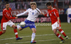 Teemu Pukki (no.10) of Finland (M) between  Aleksandar Dragovic (no.3) of Austria (L) and Franz Schiemer (no.4) of Austria (R) during friendly football match between Austria and Finland. Friendly football match between Austria and Finland, was played on Wednesday, 29th of February 2012, on Worthersee Stadium in Klagenfurt, Austria.
