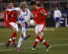 Teemu Pukki (no.10) of Finland (M) between  Aleksandar Dragovic (no.3) of Austria (L) and Franz Schiemer (no.4) of Austria (R) during friendly football match between Austria and Finland. Friendly football match between Austria and Finland, was played on Wednesday, 29th of February 2012, on Worthersee Stadium in Klagenfurt, Austria.
