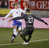 Teemu Pukki (no.10) of Finland (L) trying to play Goalie Robert Almer (no.23) of Austria (R) during friendly football match between Austria and Finland. Friendly football match between Austria and Finland, was played on Wednesday, 29th of February 2012, on Worthersee Stadium in Klagenfurt, Austria.
