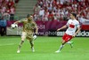 Kostas Chalkias of Greece and Robert Lewandowski of Poland during UEFA Football Euro 2012 match between Poland and Greece. Match of UEFA Football European Championships 2012 between Poland and Greece was played on Friday, 9th of June 2012 in Warszawa, Poland.
