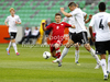 Karol Linetty of Poland (L) between German players during football half final match of UEFA U17 European championships between Germany and Poland. Half final match of UEFA U17 European championships football between Germany and Poland, was played on Sunday, 13th of May 2012, in Stozice Stadium in Ljubljana, Slovenia.
