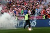 Croatian fans throwing fire torches to field during UEFA Football Euro 2012 match between Italy and Croatia. Match of UEFA Football European Championships 2012 between Italy and Croatia was played on Thursday, 14th of June 2012 in Poznan, Poland.
