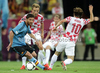 Xavi Alonso of Spain, Ivan Rakitic of Croatia, Luka Modric of Croatia during UEFA Football Euro 2012 match between Croatia and Spain. Match of UEFA Football European Championships 2012 between Croatia and Spain was played on Monday, 18th of June 2012 in Gdansk, Poland.
