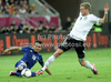 Sotiris ninis of Greece, Andre Schurrle of Gremany during UEFA Football Euro 2012 quarter final match between  Germany and Greece. Match of UEFA Football European Championships 2012 between Germany and Greece was played on Friday, 22th of June 2012 in Gdansk, Poland.
