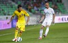 Cristian Tanase (no.10) of Romania (L) and Miso Brecko (no.2) of Slovenia (R) during friendly football match between Slovenia and Romania. Match between Slovenia and Romania was played in Stozice arena in Ljubljana, Slovenia, on Wednesday, 15th of August 2012.
