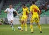 Jasmin Kurtic (no.8) of Slovenia (L), Bogdan Stancu (no.19) (M) and Razvan Cocis (no.16) of Romania (R) during friendly football match between Slovenia and Romania. Match between Slovenia and Romania was played in Stozice arena in Ljubljana, Slovenia, on Wednesday, 15th of August 2012.
