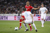 Eren Derdiyok of Switzerland (L) and Bostjan Cesar of Slovenia (R) during FIFA World cup 2014 qualification football match between Slovenia and Switzerland. Match between Slovenia and Switzerland was played in Stozice arena in Ljubljana, Slovenia, on Friday, 7th of September 2012.
